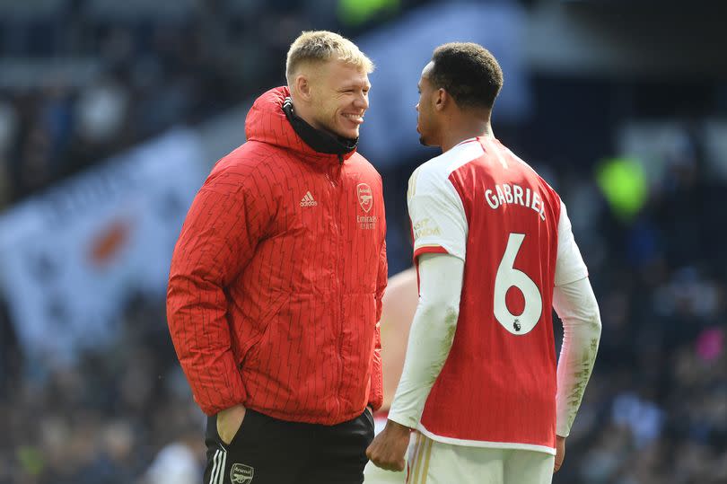 Aaron Ramsdale and Gabriel of Arsenal celebrate after the team's victory during the Premier League match between Tottenham Hotspur and Arsenal FC at Tottenham Hotspur Stadium on April 28, 2024 in London, England.
