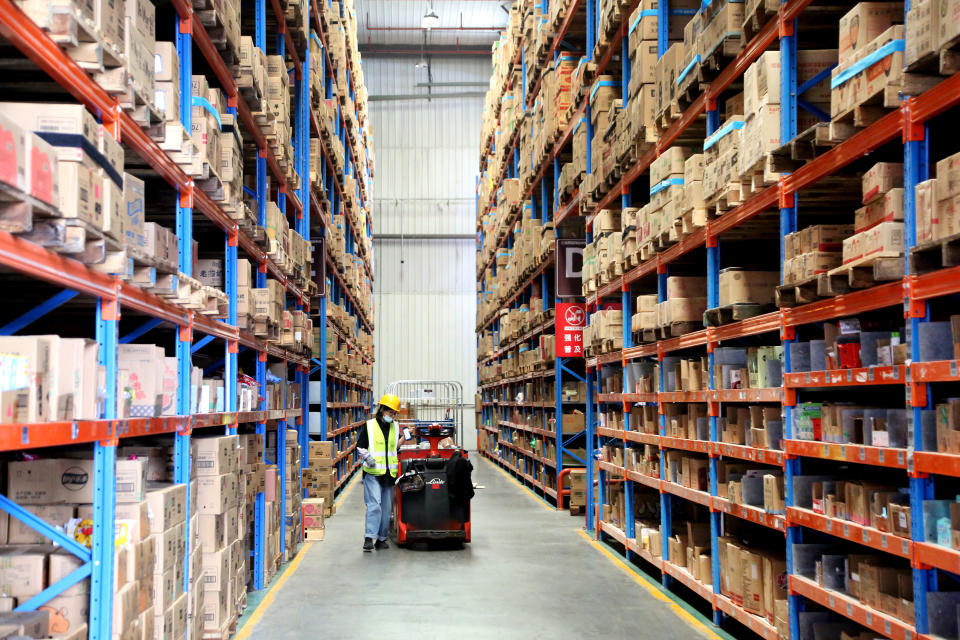 A staff member delivers goods in accordance with orders from the 618 online Shopping Festival at the warehouse of Jiadelfu E-commerce Logistics Park in Lianyun District, Lianyungang, East China's Jiangsu province, June 16, 2023. (Photo by Costfoto/NurPhoto via Getty Images)