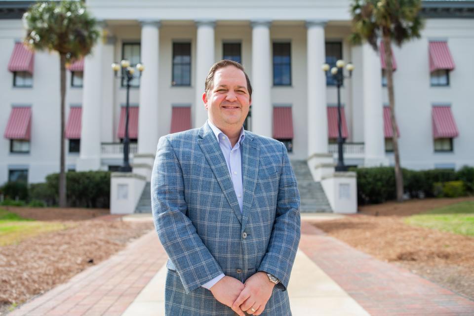 Republican Party of Florida Chairman Evan Power poses for a portrait in front of the Historic Florida Capitol building on Thursday, Feb. 8, 2024.