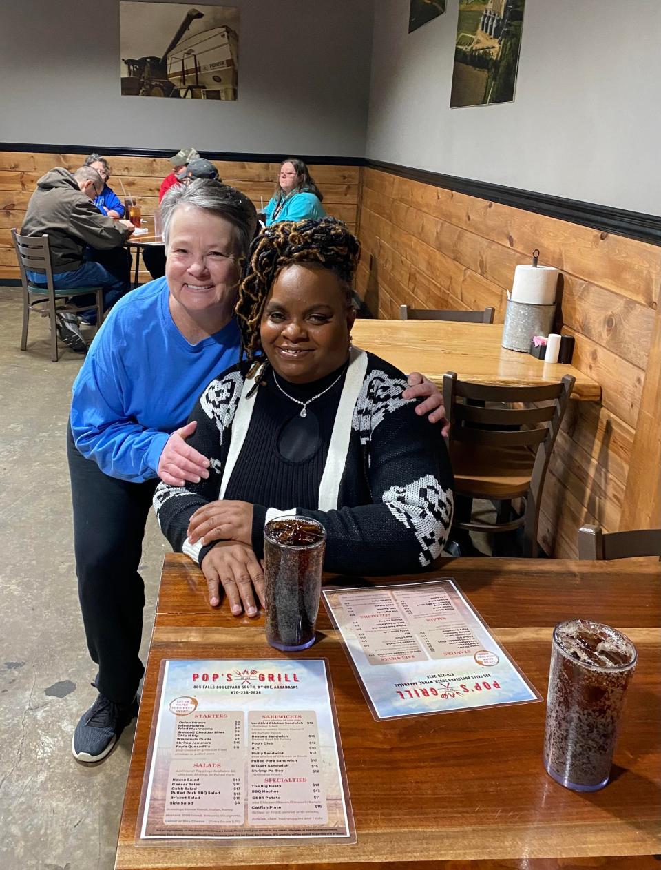 At their first meeting, Dee Harkrider poses for a photo with Rachel Johnson, the mother of Delivontae Johnson, the man who returned Harkrider's lost wallet to her last month.