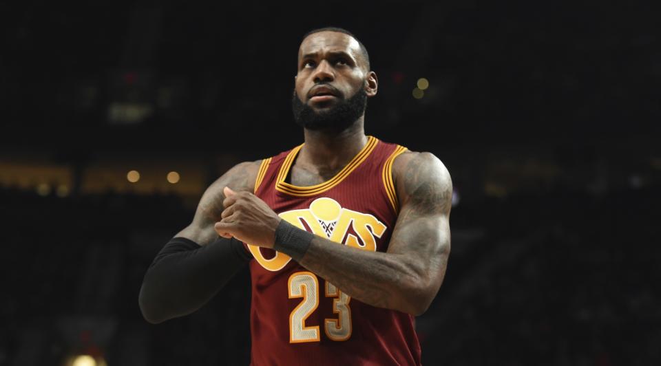 Cleveland Cavaliers forward LeBron James adjusts his jersey during the second half of an NBA basketball game against the Portland Trail Blazers in Portland, Ore., Wednesday, Jan. 11, 2017. (AP Photo/Steve Dykes)