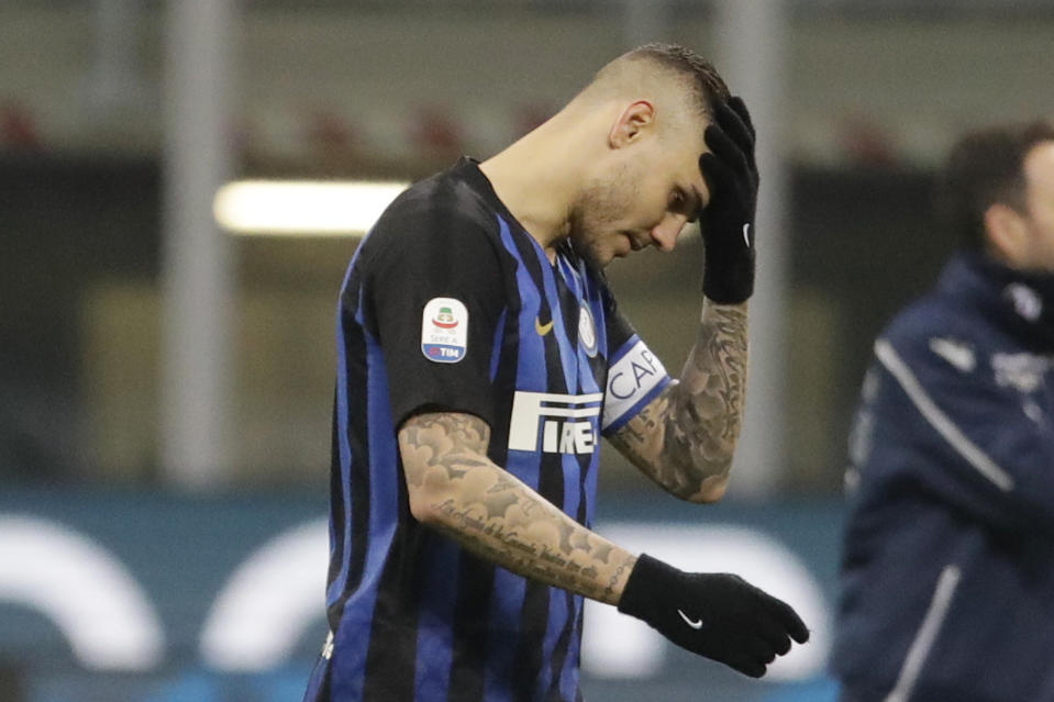 FILE - In this Sunday, Feb. 3, 2019 file photo, Inter Milan's Mauro Icardi walks off the pitch at the end of a Serie A soccer match between Inter Milan and Bologna, at the San Siro stadium in Milan, Italy. Two months ago, Mauro Icardi was one of Inter Milan's favored players, on Thursday, Feb. 14, 2019, he was training with just a handful of teammates at their training ground after a rapid fall from grace after Icardi and Inter have been in protracted talks over renewing his contract, which expires in 2021, with agent-wife Wanda Nara being particularly outspoken over the past month. (AP Photo/Luca Bruno, File)