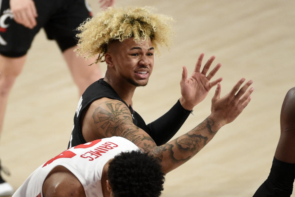 Cincinnati guard Mike Saunders (3) reacts after being called for a foul during the first half of an NCAA college basketball game against Houston, Sunday, Feb. 21, 2021, in Houston. (AP Photo/Eric Christian Smith)