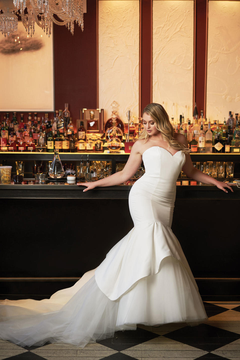 <p>Lawrence wears a strapless white mermaid dress with tulle train by Justin Alexander. (Photo: courtesy of Justin Alexander) </p>