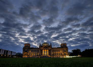 File-In Sept. 26, 2021 taken photo clouds drift over the Reichstag building with the German parliament in Berlin. The parliament gather for the first plenary session after the elections. (AP Photo/Michael Probst)