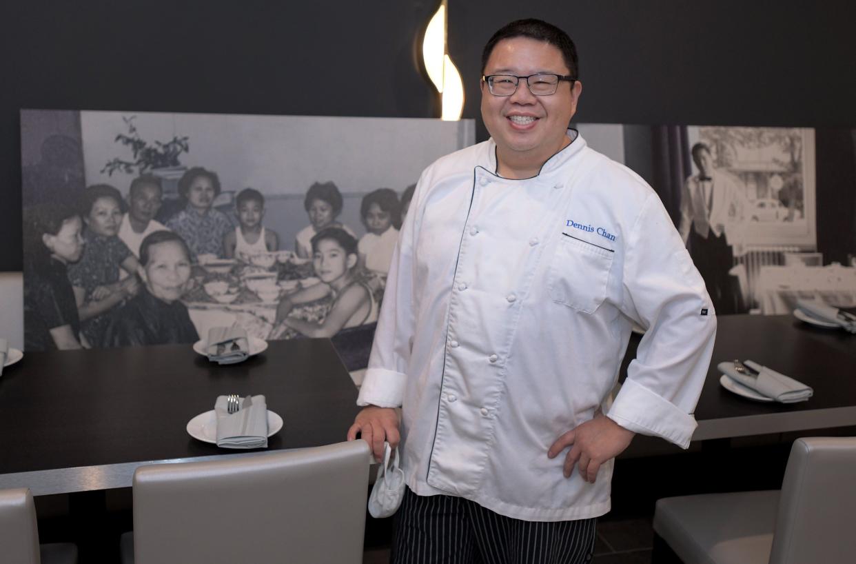 Jacksonville Chef Dennis Chan, pictured in front of enlarged vintage photos of his family on the wall of the lounge at his restaurant Blue Bamboo Canton Bistro in Mandarin.