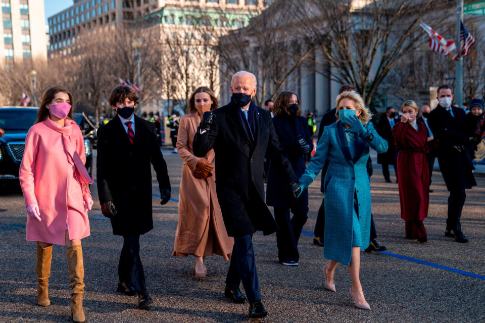 <p>For the post-Inauguration parade, Joe and Jill held hands to lead their large group, which included their grandchildren (from left, Natalie, Hunter and Finnegan).</p>