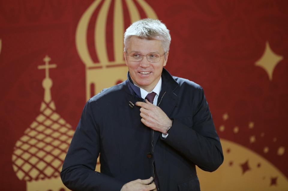 FILE - In this Dec. 1, 2017, file photo, Russia's Sport Minister Pavel Kolobkov arrives for the 2018 soccer World Cup draw in the Kremlin in Moscow, Russia. A year after hosting the World Cup, Russia is boasting the biggest club soccer crowds since Soviet days and participation at the amateur level is on the rise. Still, there are signs of trouble for the sport. (AP Photo/Dmitri Lovetsky, File)