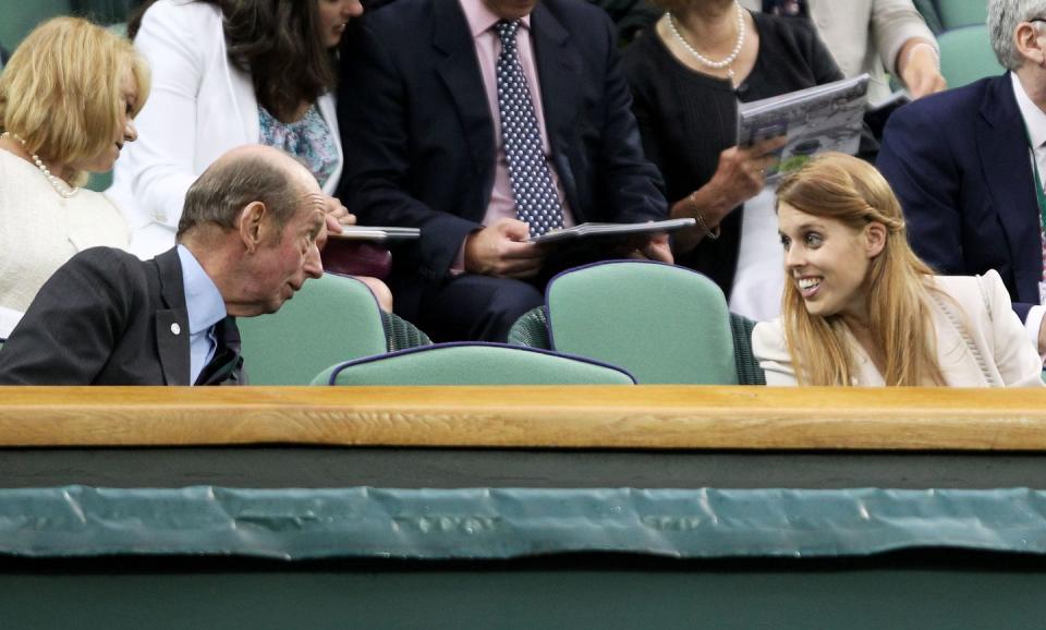 <p>Princess Eugenie chats with Prince Edward, Duke of Kent, between matches.</p>