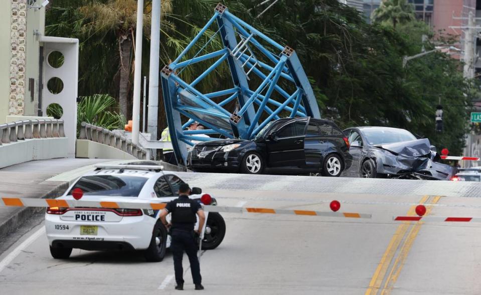 A construction worker was killed and two people were taken to the hospital after a portion of a crane dropped onto the Southeast Third Avenue bridge over the New River in downtown Fort Lauderdale on Thursday afternoon, April 4, 2024. (Carline Jean/South Florida Sun Sentinel)