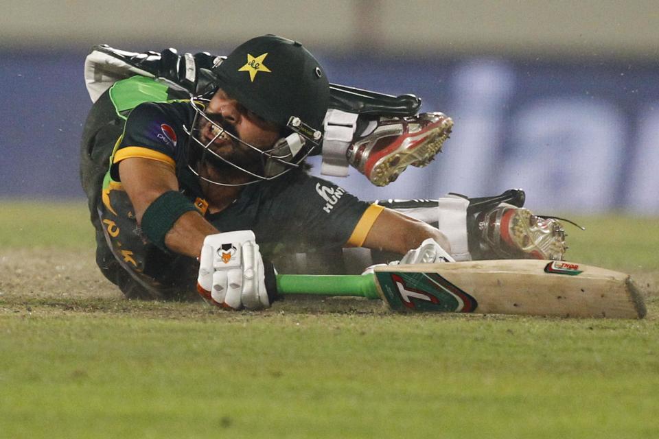 Pakistan’s Fawad Alam drives to makes his ground during their match against Bangladesh in the Asia Cup one-day international cricket tournament in Dhaka, Bangladesh, Tuesday, March 4, 2014. (AP Photo/A.M. Ahad)