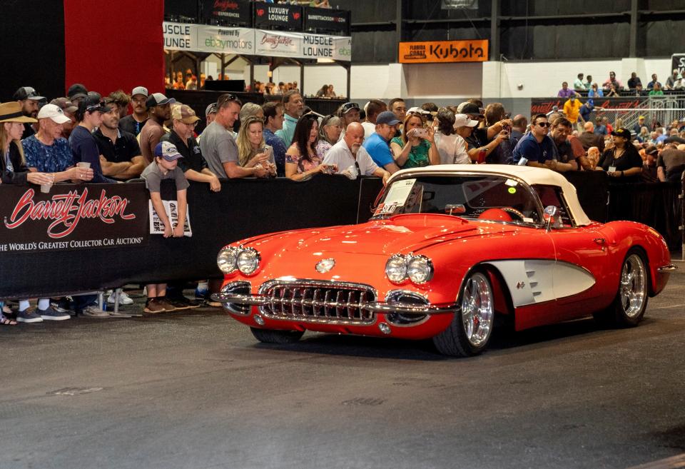 1960 Corvette Custom Convertible rolls off the auction block after being sold at the Barrett-Jackson Car Show 2022 Palm Beach Auction at the South Florida Fairgrounds.