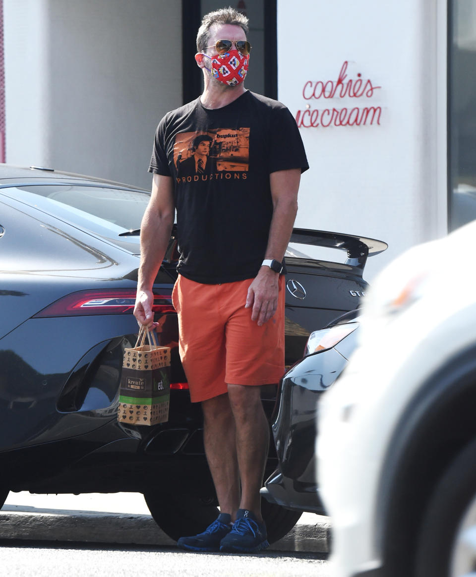 <p>Jon Hamm is seen wearing a Batman-inspired mask as he leaves an office building in Beverly Hills on Thursday.</p>