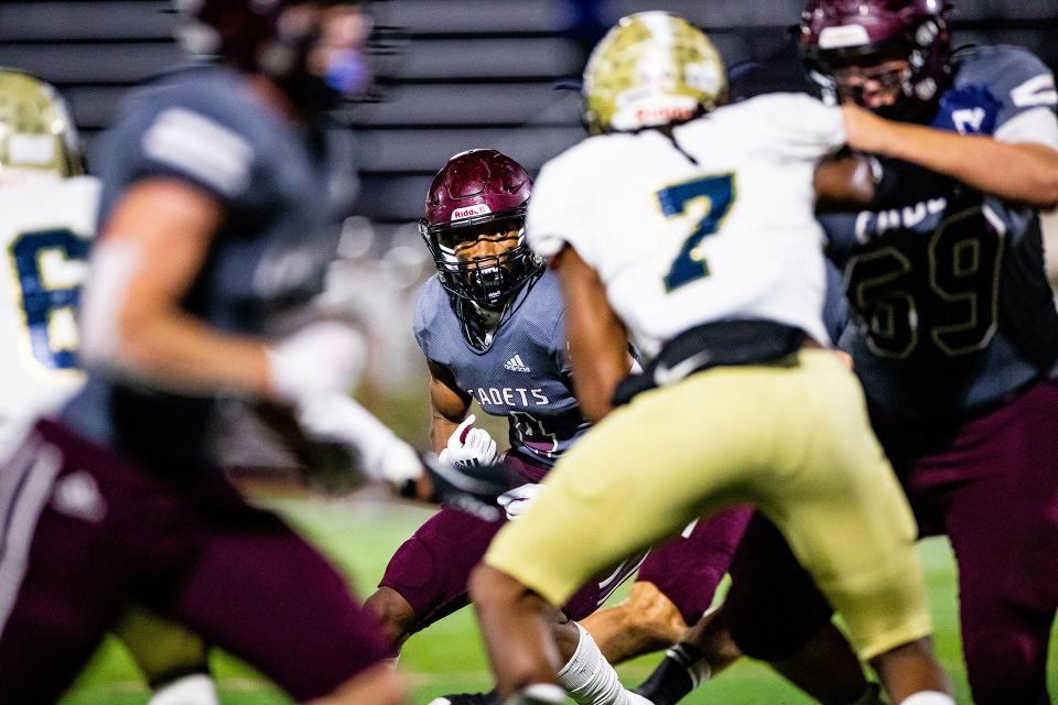 Benedictine's Justin Thomas looks for running room against the Thomas County Central defense in the Class 4A opener Nov. 12 at Memorial Stadium.