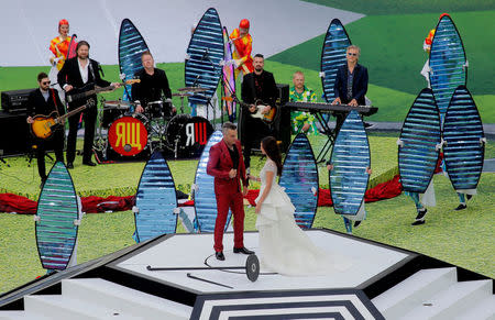 Soccer Football - World Cup - Opening Ceremony - Luzhniki Stadium, Moscow, Russia - June 14, 2018 Robbie Williams and Aida Garifullina perform during the opening ceremony REUTERS/Maxim Shemetov