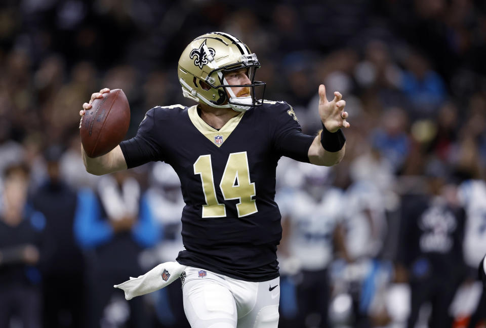 FILE - New Orleans Saints quarterback Andy Dalton prepares to throw during the team's NFL football game against the Carolina Panthers, Jan. 8, 2023, in New Orleans. The Carolina Panthers have agreed to a two-year, $10 million contract with unrestricted free agent Dalton, according to two people familiar with the situation. One of those persons, who spoke to The Associated Press on condition of anonymity Tuesday, March 14, because the deal can’t be signed until Wednesday, said the deal includes $8 million in guaranteed money. (AP Photo/Tyler Kaufman)