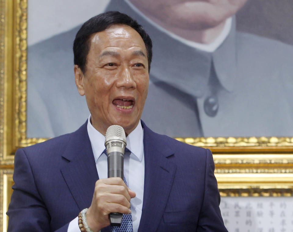Terry Gou, the head of the world's largest electronics supplier Foxconn, speaks to the media after meeting with Nationalist Party chairman Wu Den-yih at the party headquarters in Taipei, Taiwan, Monday, May 13, 2019. Gou plans to run for president of Taiwan, bringing his pro-business and pro-China policies to what is expected to be a crowded field for next year's election. (AP Photo/Chiang Ying-ying)