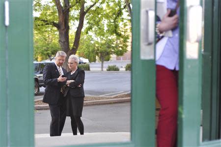 Challenger Bryan Smith chats with his wife Sharon after his debate with incumbent Congressman Mike Simpson (R-ID) outside the studios of Idaho Public Television in Boise, Idaho May 11, 2014. REUTERS/Patrick Sweeney