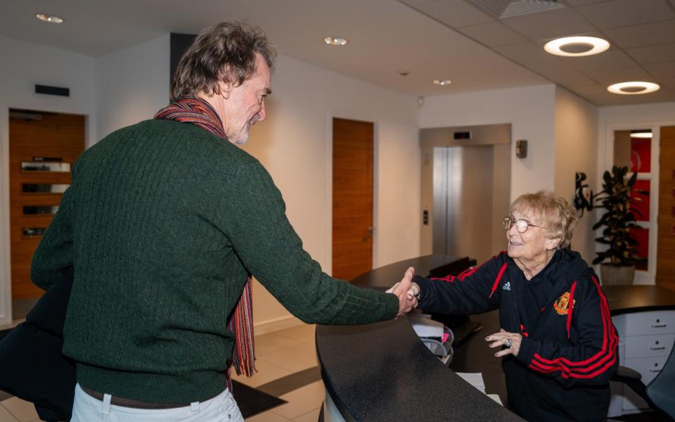 Sir Jim Ratcliffe is greeted by long-serving receptionist Kath Phipps