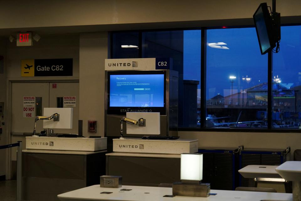 A United Airlines monitor displays a blue error screen inside Terminal C in Newark International Airport, after United Airlines and other airlines grounded flights due to a worldwide tech outage caused by an update to Crowdstrike's "Falcon Sensor" software which crashed Microsoft Windows systems, in Newark, New Jersey, U.S., July 19, 2024.