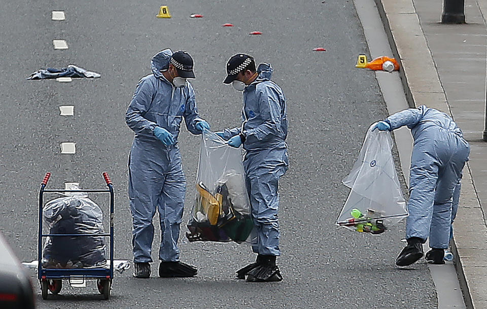 Police forensic officers work and collect evidence on London Bridge as police continue their investigations.&nbsp;