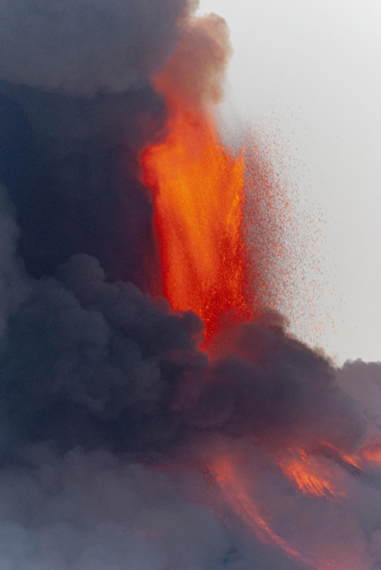 Lava gushes from the Mt Etna volcano near Catania, Sicily, Tuesday, Feb. 16, 2021. Europe's most active volcano came alive around 4 pm local time on Tuesday, according to the Italian Institute of Geophysics and Volcanology. (AP Photo/Salvatore Allegra)