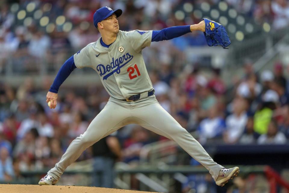 Dodgers pitcher Walker Buehler delivers during the first inning Sunday against the Braves.