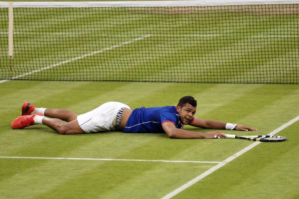 LONDON, ENGLAND - JULY 29: Jo-Wilfried Tsonga of France celebrates match point during the Men's Singles Tennis match against Thomaz Bellucci of Brazil on Day 2 of the London 2012 Olympic Games at the All England Lawn Tennis and Croquet Club in Wimbledon on July 29, 2012 in London, England. (Photo by Clive Brunskill/Getty Images)