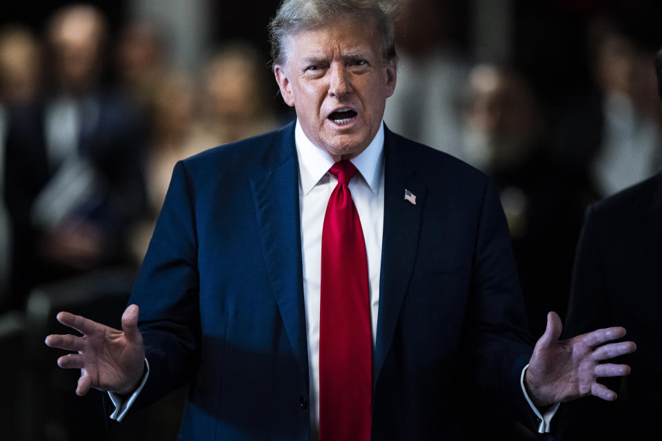 Former President Donald Trump speaks as he arrives at Manhattan criminal court with his legal team ahead of the start of jury selection in New York, Monday, April 15, 2024. (Jabin Botsford/The Washington Post via AP, Pool)