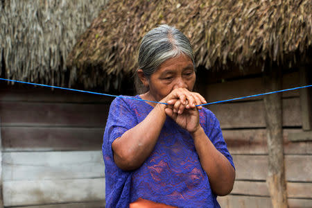 Elvira Choc, 59 grandmother of Jakelin, a 7-year-old girl who died in U.S. custody, stands outside her house in Raxruha, Guatemala December 15, 2018. REUTERS/Josue Decavele