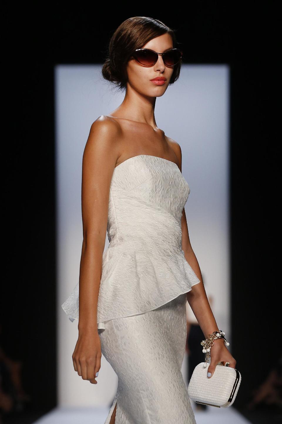 The Badgley Mischka Spring 2014 collection is modeled during Fashion Week in New York, Tuesday, Sept. 10, 2013. (AP Photo/John Minchillo)