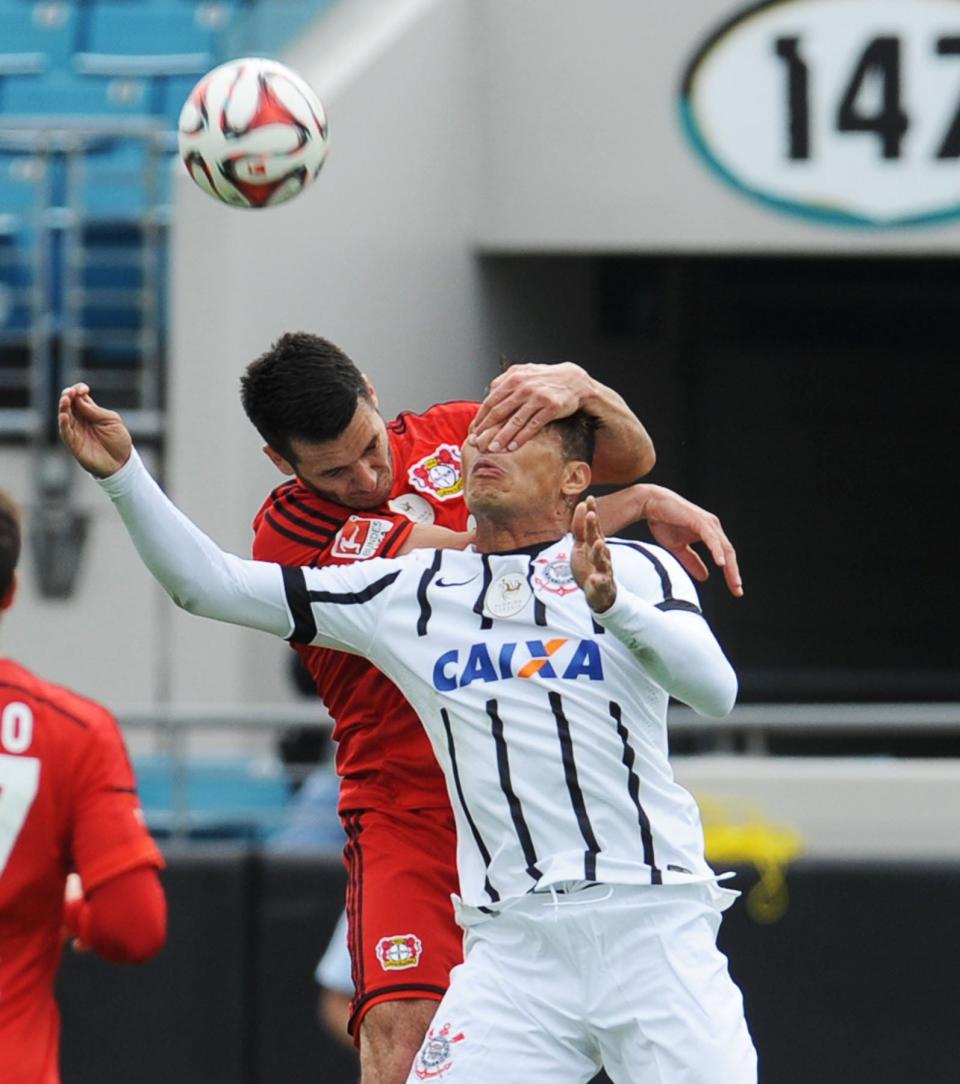 Corinthians forward Paolo Guerrero (right) challenges for a header with Bayer Leverkusen defender Emir Spahic during the Florida Cup at EverBank Field on January 17, 2015.