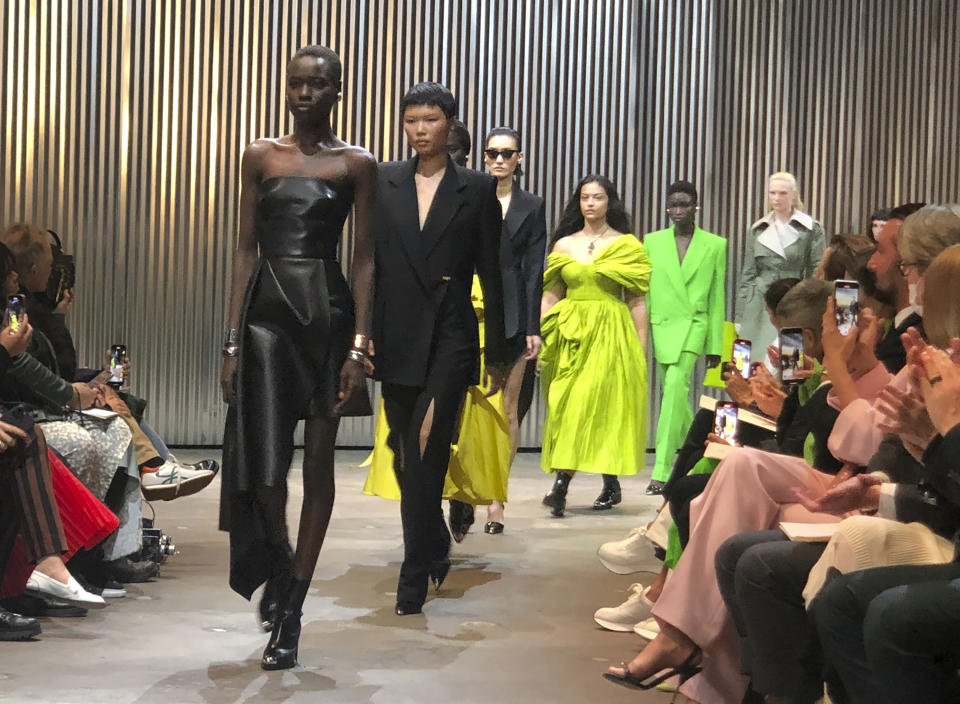 Models walk the runway wearing fashion from the Alexander McQueen Autumn/Winter 2022 collection on Tuesday, March 15, 2022 in New York. (AP Photo/Leanne Italie)