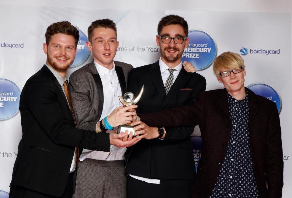 FILE - This Nov. 1, 2012 file photo shows members of Alt-J, from left, Joe Newman, Thom Green, Gus Unger-Hamilton and Gwil Sainsbury at the Barclaycard Mercury Prize Albums of the Year awards 2012 at the Camden Roundhouse in London. Their debut album, "An Awesome Wave," went on to win the prestigious Mercury Prize given to the top album of the year in the United Kingdom and Ireland. The Cambridge quartet has since been a near constant conversation piece on the blogosphere and mid-sized club circuit on both sides of the Atlantic Ocean. (Photo by John Marshall JME/Invision/AP)