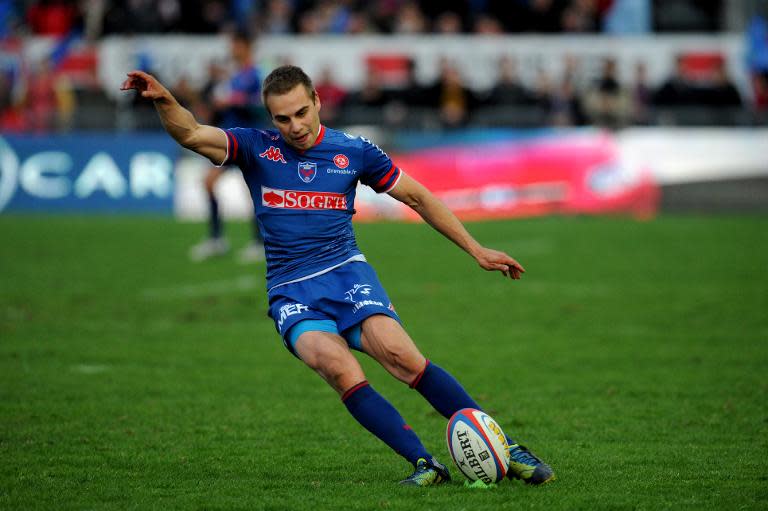 Grenoble's scrum-half James Hart kicks a penalty during a French Top 14 rugby union against Bayonne on April 19, 2014 at the Lesdiguieres stadium in Grenoble, central-eastern France