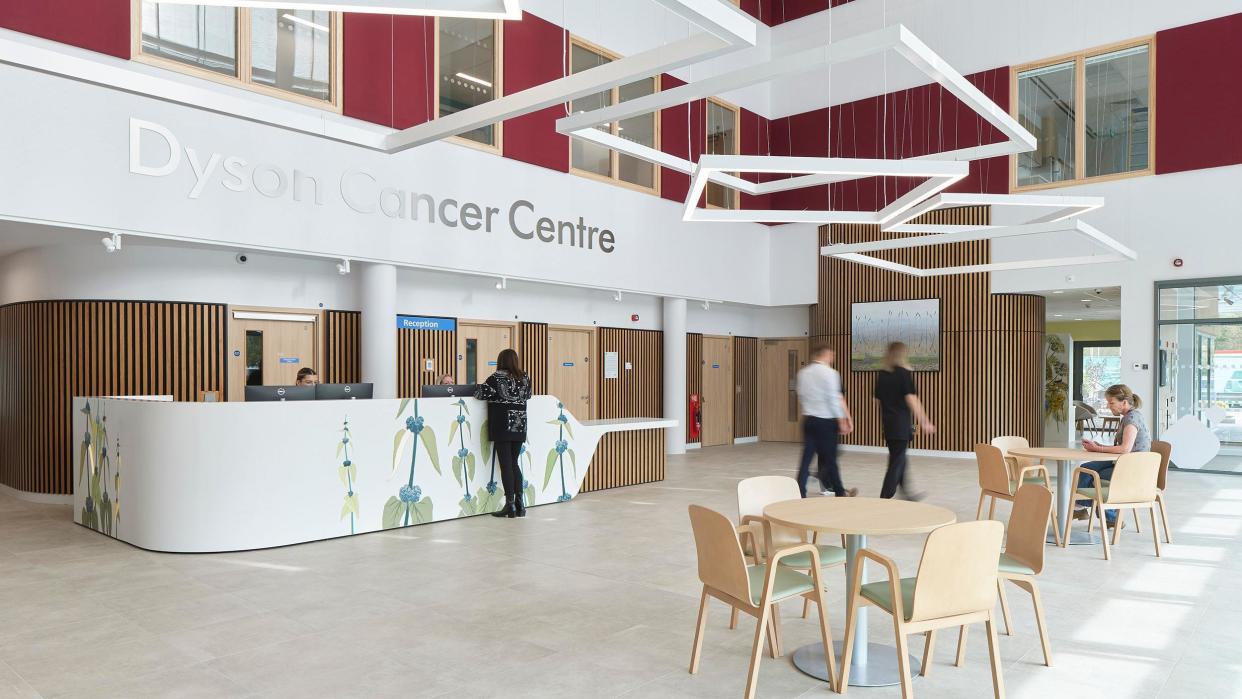 Main entrance and atrium for the Dyson Cancer Centre showing the reception desk and seating