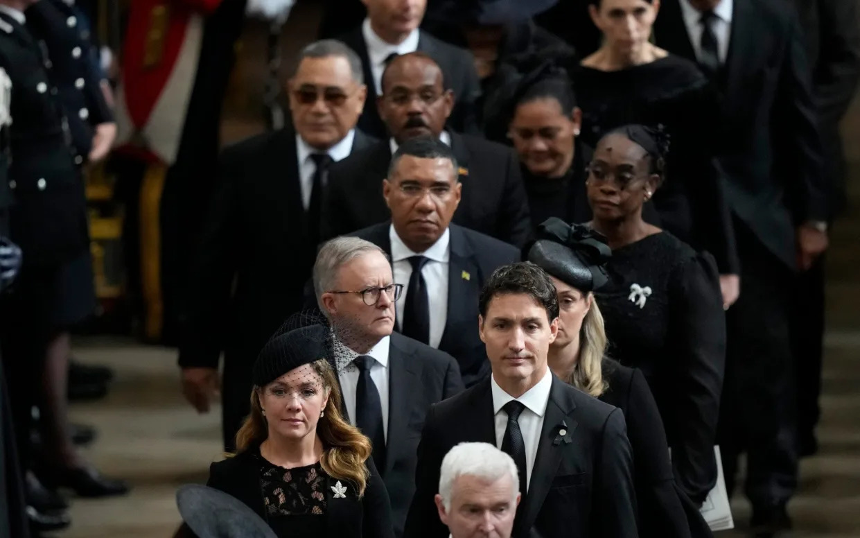 Canada's Prime Minister Justin Trudeau, front right, and his wife Sophie Gregoire, front left, walk with other dignitaries out of Westminster Abbey - Frank Augstein /AP