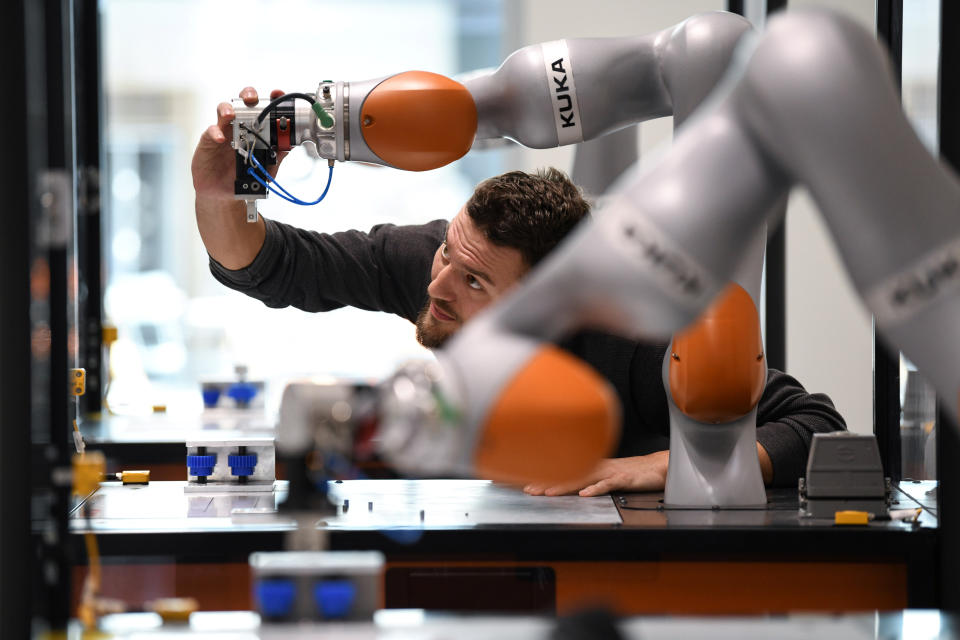 Tobias Jakob, an employee of German manufacturer of industrial robots and automation solutions KUKA, poses for pictures at the company's training center in Augsburg, Germany, March 28, 2019. REUTERS/Andreas Gebert