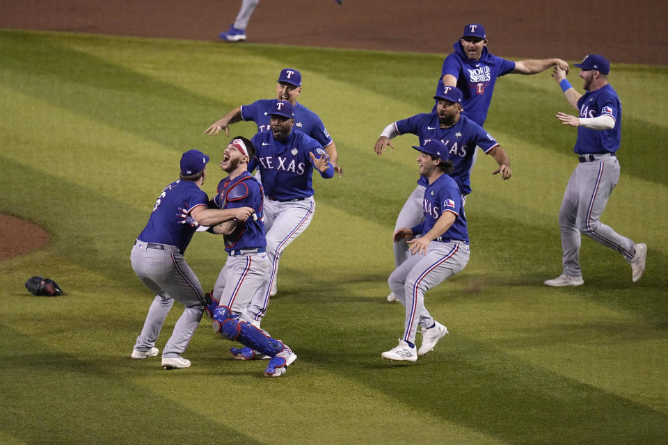 Texas Rangers celebrate after winning Game 5 of the baseball World Series against the Arizona Diamondbacks Wednesday, Nov. 1, 2023, in Phoenix. The Rangers won 5-0 to win the series 4-1. (AP Photo/Gregory Bull)