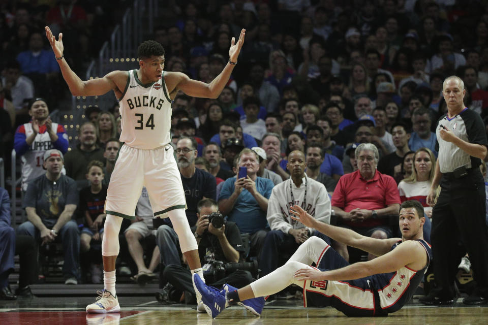 Milwaukee Bucks' Giannis Antetokounmpo, left, of Greece, looks at Los Angeles Clippers' Danilo Gallinari, of Italy, after getting a foul call during the second half of an NBA basketball game Saturday, Nov. 10, 2018, in Los Angeles. The Clippers won 128-126 in overtime. (AP Photo/Jae C. Hong)