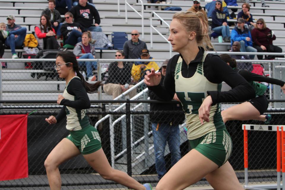 Howell's Annie Yang (left) and Kaitlyn Ward have Livingston County's fastest times in the 100-meter hurdles through April.