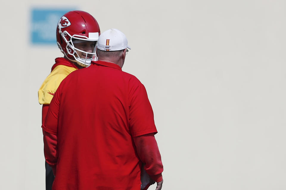 Kansas City Chiefs quarterback Patrick Mahomes (15) talks with head coach Andy Reid during practice on Friday, Jan. 31, 2020, in Davie, Fla., for the NFL Super Bowl 54 football game. (AP Photo/Brynn Anderson)