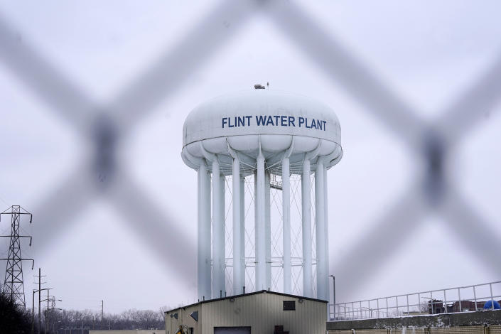 FILE - The Flint water plant tower is seen on Jan. 6, 2022, in Flint, Mich. A Michigan judge dismissed charges Tuesday, Oct. 4, 2022, against seven people in the Flint water scandal, including two former state health officials blamed for deaths from Legionnaires' disease. Judge Elizabeth Kelly took action three months after the Michigan Supreme Court said a one-judge grand jury had no authority to issue indictments. (AP Photo/Carlos Osorio, File)