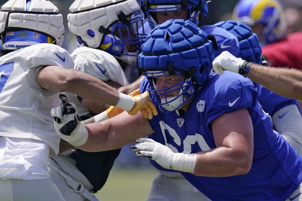 Rams guard Logan Bruss runs a play during a practice session on July 30.