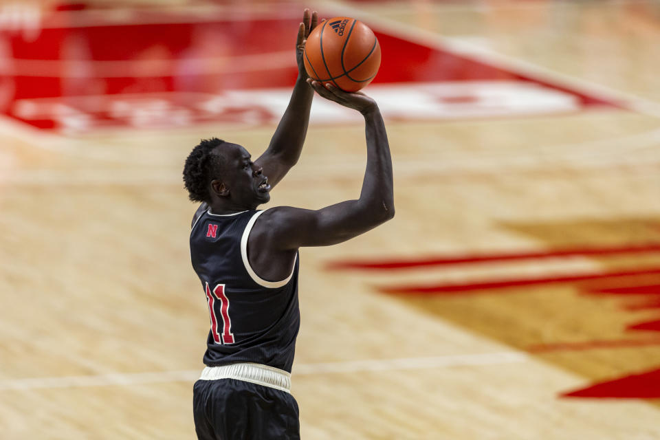 Nebraska forward Lat Mayen (11) makes a three-point basket against Rutgers in the first half during an NCAA college basketball game Monday, March 1, 2021, in Lincoln, Neb. (AP Photo/John Peterson)