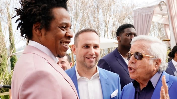 This photo from 2020 Roc Nation THE BRUNCH in Los Angeles shows (from left) Jay-Z, Michael Rubin and Robert Kraft in conversation. (Photo by Erik Voake/Getty Images for Roc Nation)