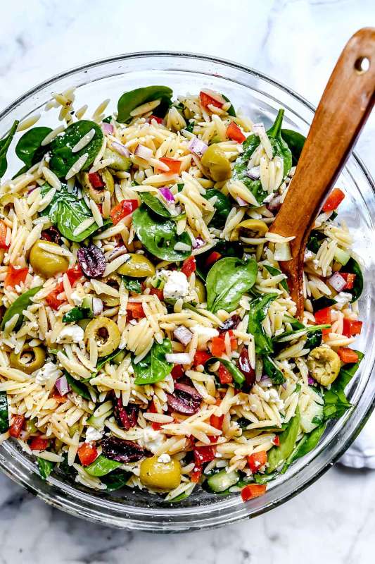 <p>Foodie Crush</p><p>This vegetarian Mediterranean orzo pasta salad with crunchy vegetables and spinach, briny olives, and feta cheese makes a healthy, easy-to-make, meal-prepped meal or flavorful pasta salad side.</p><p><strong>Get the recipe: <a href="https://www.foodiecrush.com/mediterranean-orzo-salad/" rel="nofollow noopener" target="_blank" data-ylk="slk:Mediterranean Orzo Salad;elm:context_link;itc:0;sec:content-canvas" class="link ">Mediterranean Orzo Salad</a></strong></p>
