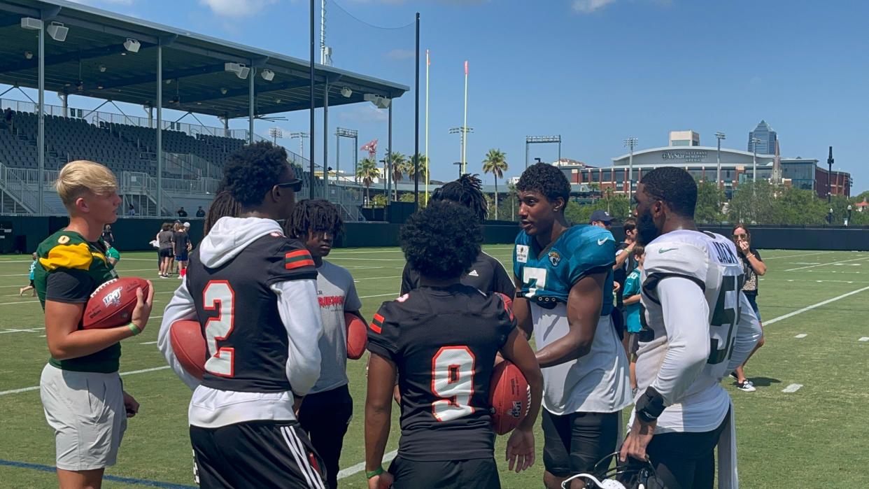 Jacksonville Jaguars wide receiver Zay Jones talks with local wide receivers after a training camp practice.