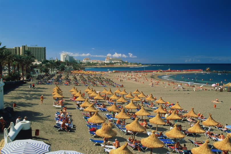 Tourists on Playa de las Americas beach on Tenerife -Credit:Getty Images