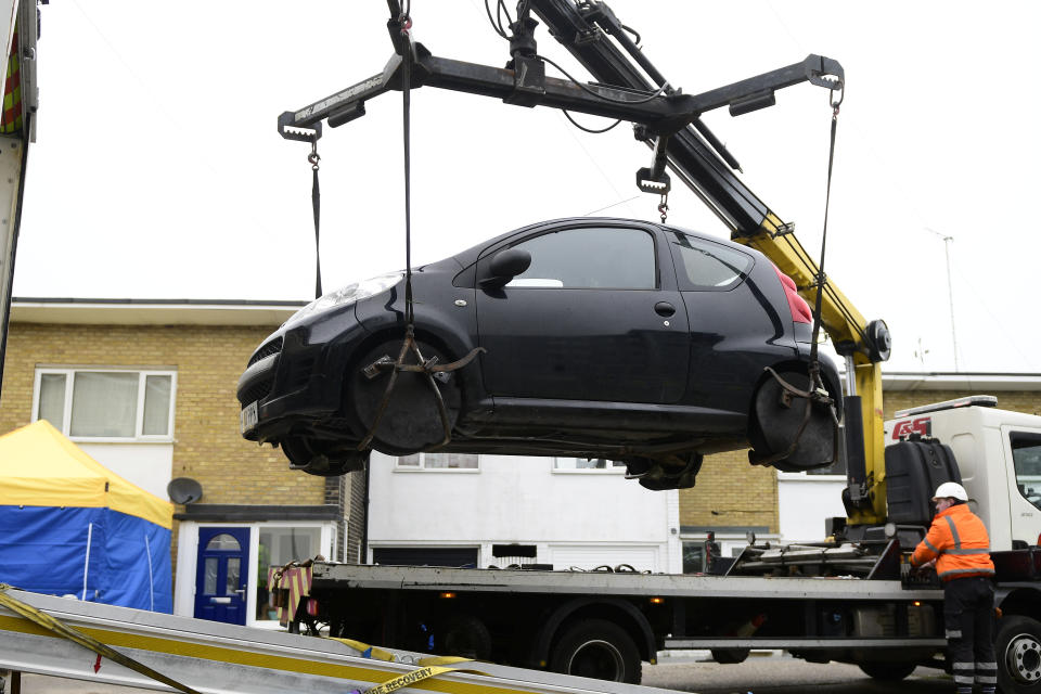 A vehicle is removed from outside a property in Ashford, Kent, earlier this week during police investigations. (SWNS)